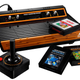 A Lego Atari 2600, with its joystick, and three Lego cartridges.